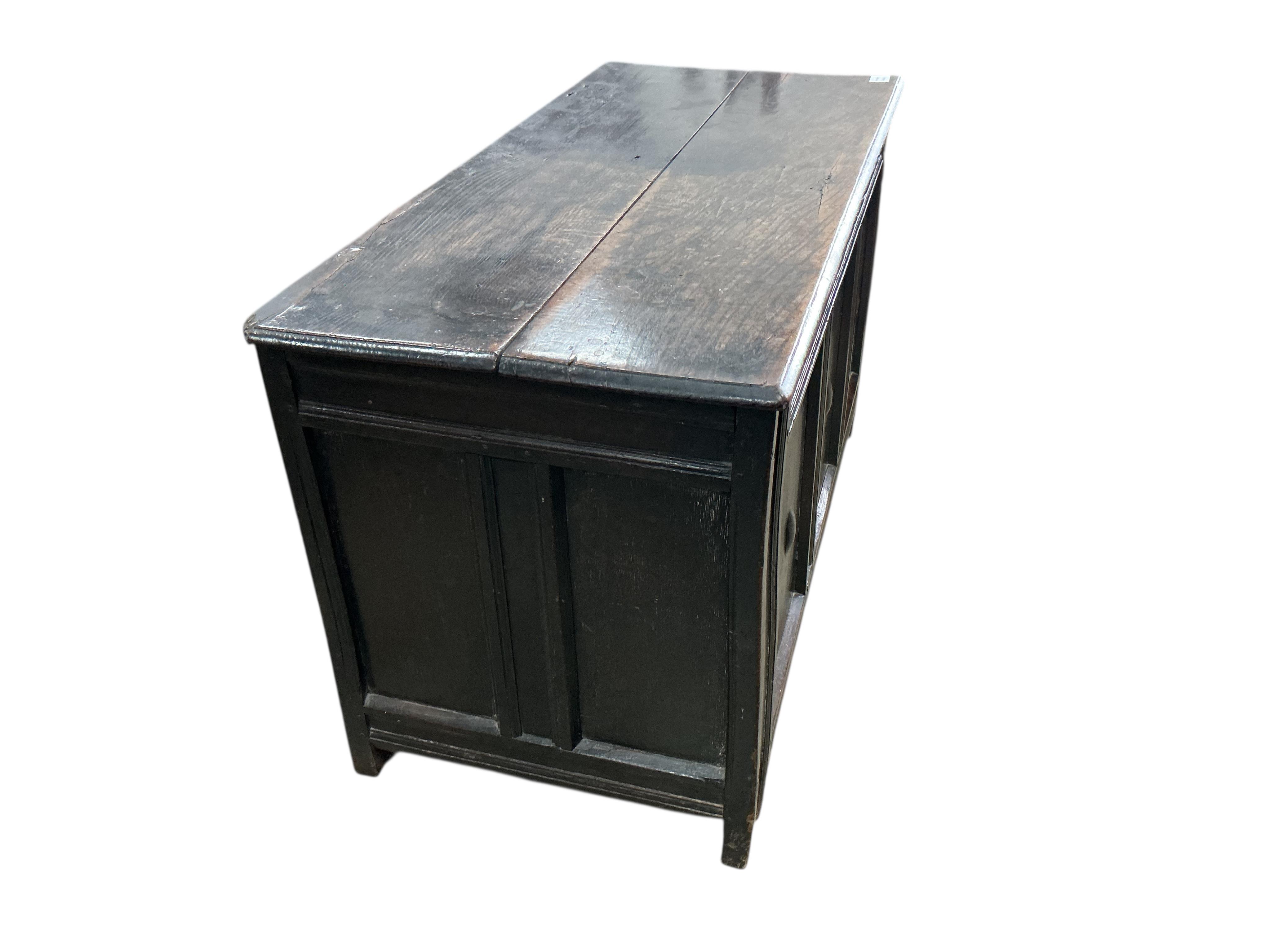 An early 18th century panelled oak coffer, width 120cm, depth 54cm, height 66cm